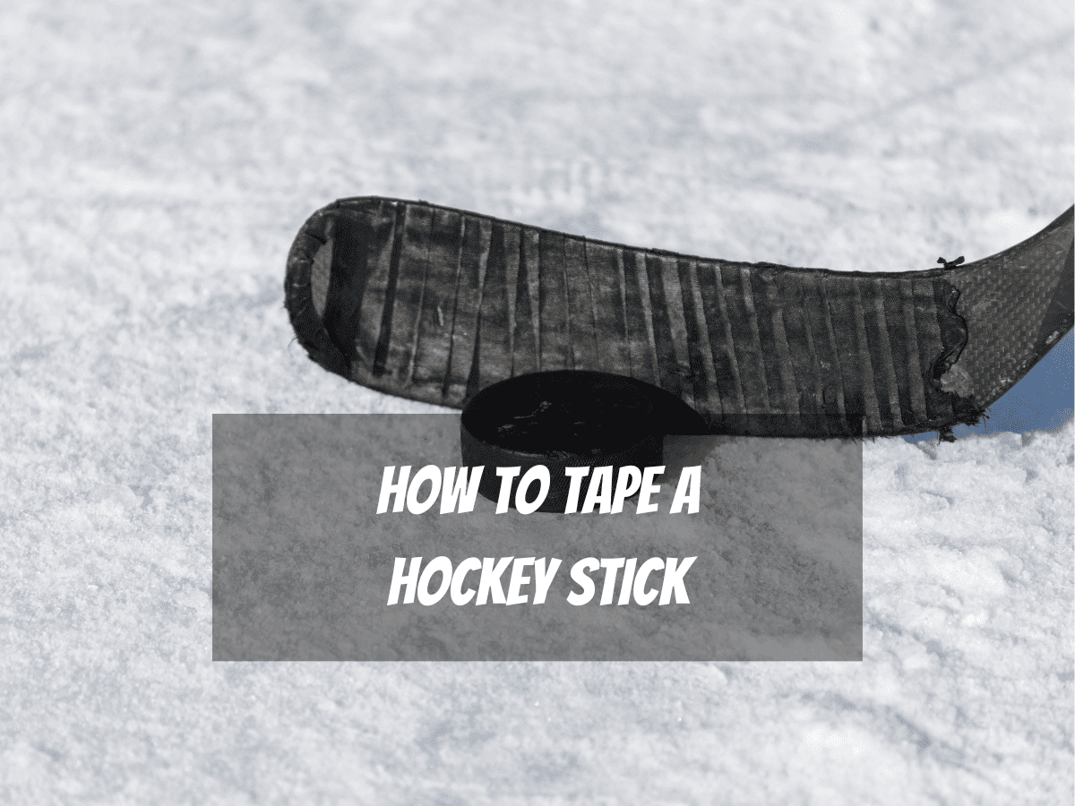 A Hockey Stick With Black Tape About To Hit A Puck Is A Good Example Of How To Tape A Hockey Stick
